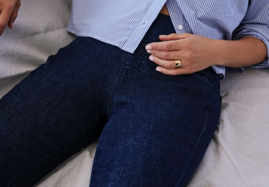 Pull-on jeans with a skinny leg featuring a mid rise and dark indigo wash