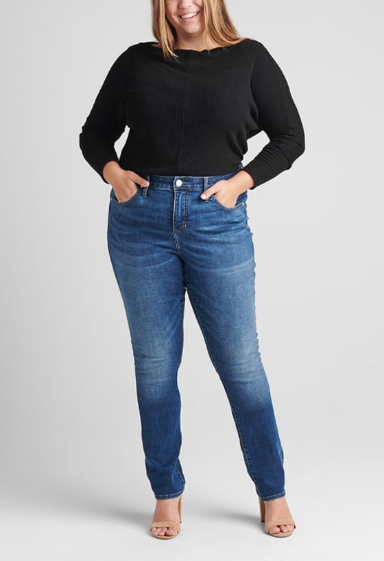 Women’s curvy fit straight leg jeans featuring a mid rise and medium indigo wash