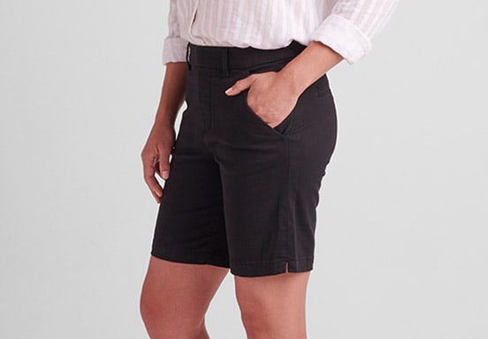 Plus size pull-on bermuda shorts with a mid rise and medium indigo wash